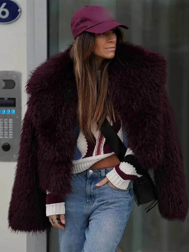 Women's burgundy faux fur coat featuring an oversized collar and soft texture, perfect for stylish warmth in cool weather.