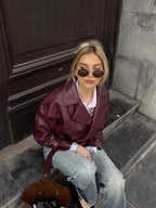 Women's burgundy short belted trench coat made of durable cotton blend, featuring a classic design and stylish waist tie.