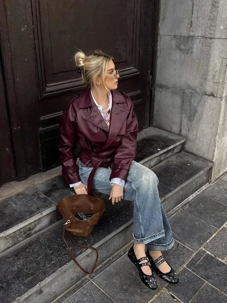 Women's burgundy short belted trench coat made of durable cotton blend, featuring a tailored fit and classic lapel collar.