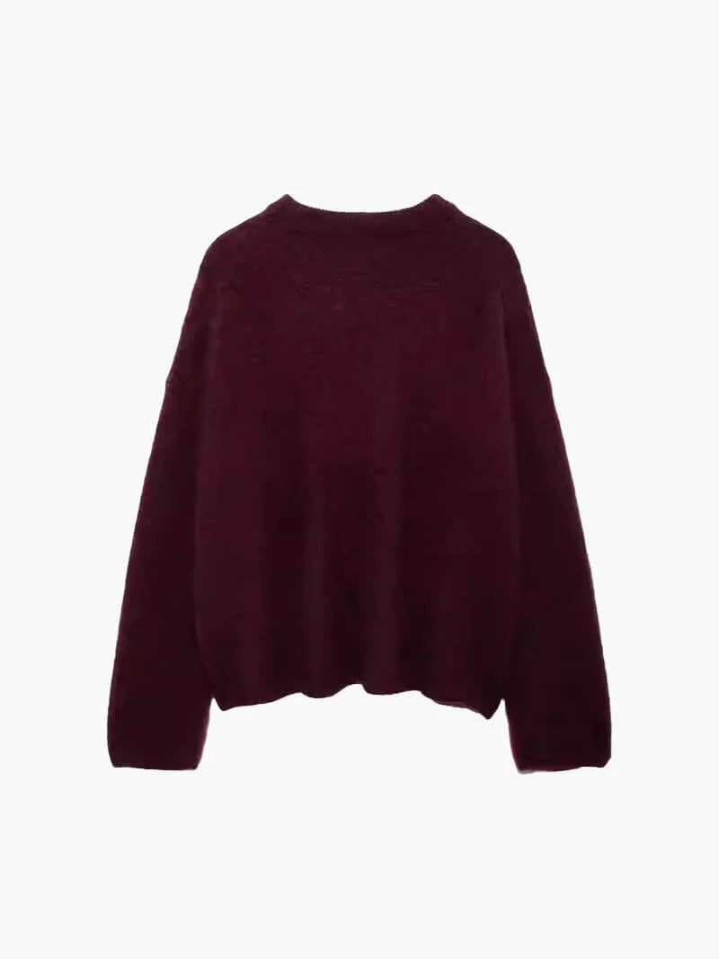 Alt text: Women’s burgundy sweater featuring balloon sleeves, crafted from soft knit fabric for a relaxed and cozy fit.