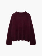Alt text: Women’s burgundy sweater featuring balloon sleeves, crafted from soft knit fabric for a relaxed and cozy fit.
