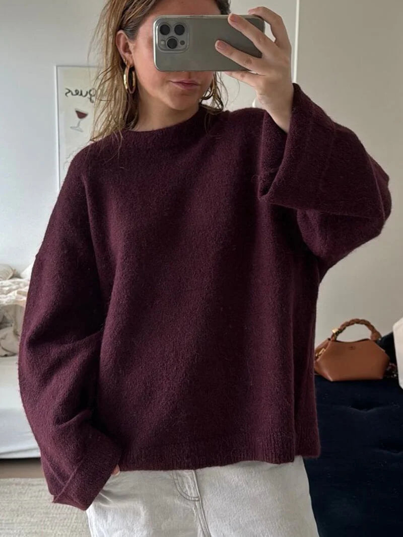 Burgundy women's sweater featuring balloon sleeves, made from soft knit fabric for comfort and warmth during chilly days.