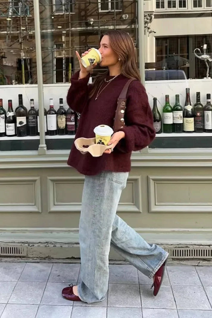 Women's burgundy sweater featuring balloon sleeves, soft knit fabric, and a relaxed fit for comfortable, everyday wear.