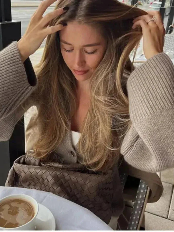 Women's button-front cardigan with wide sleeves, crafted from soft knit fabric, featuring a relaxed fit and ribbed cuffs.
