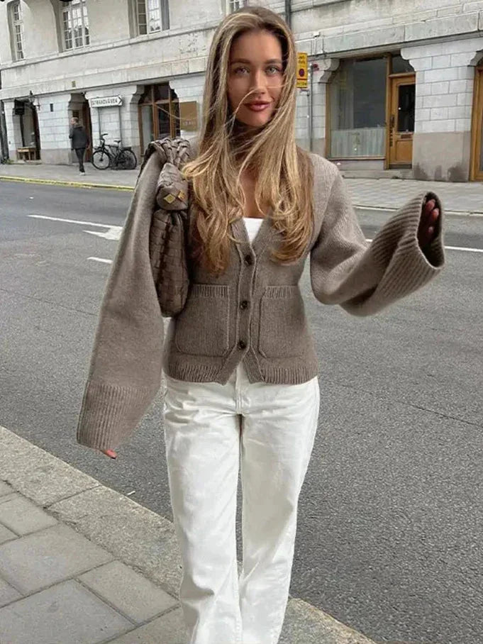 Women's button-front cardigan with wide sleeves, made of soft knit fabric for comfort, featuring a relaxed fit and classic…