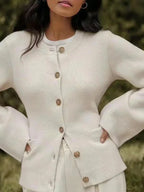 Women's button-up cardigan with long sleeves made of soft cotton blend; features a relaxed fit and ribbed cuffs for comfort.