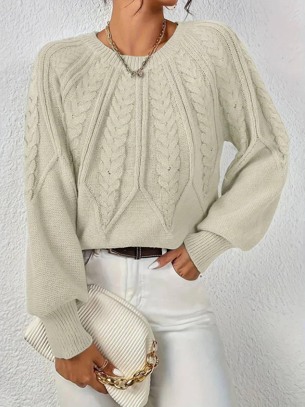 Women's cable-knit sweater featuring a textured pattern, crafted from soft acrylic blend for warmth and comfort.