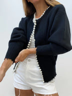 Women's open front cardigan featuring pearl trim, made from soft knit fabric for comfort and style. Perfect for layering.