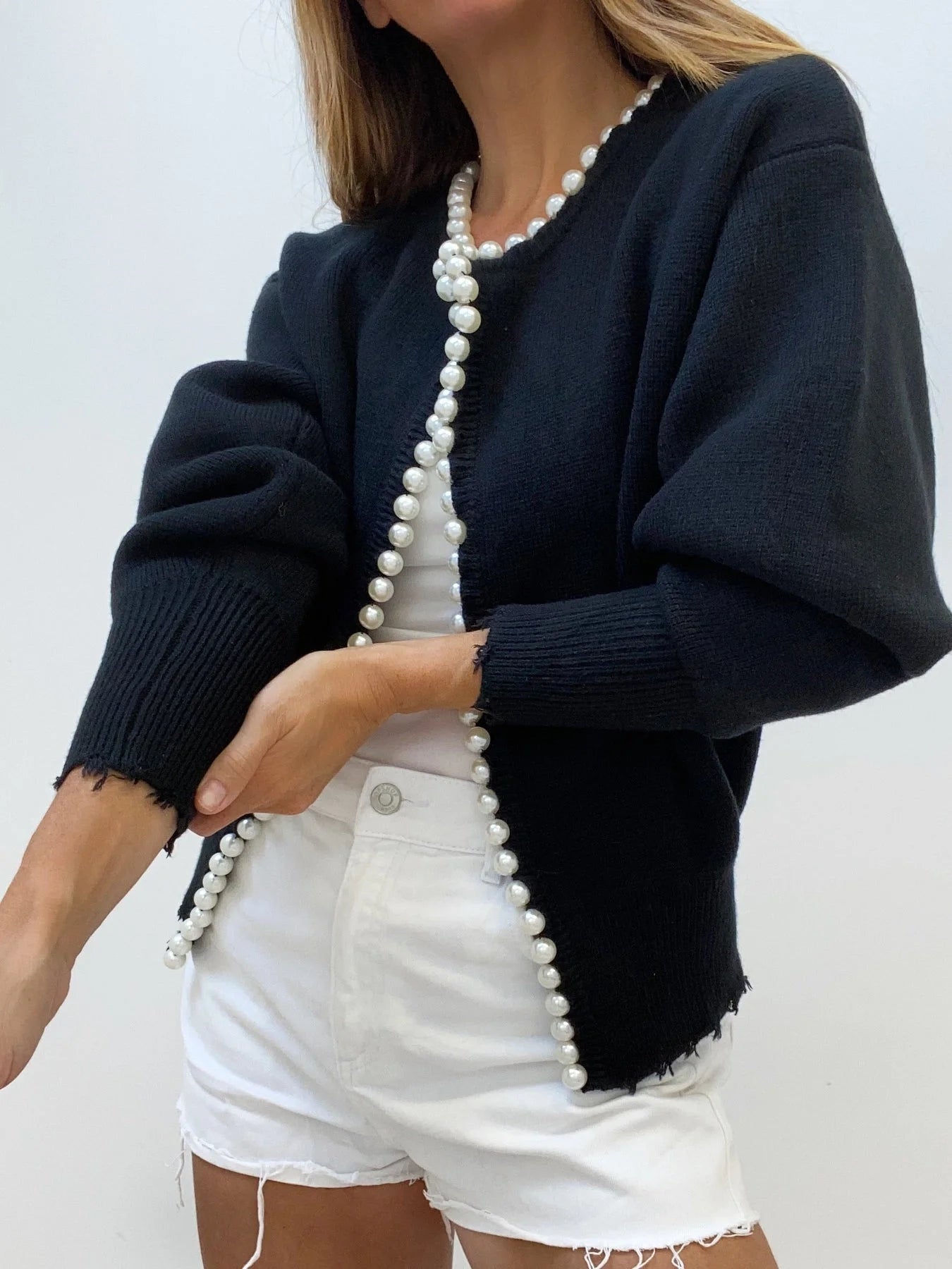 Women's open front cardigan featuring pearl trim, made from soft knit fabric for comfort and style. Perfect for layering.