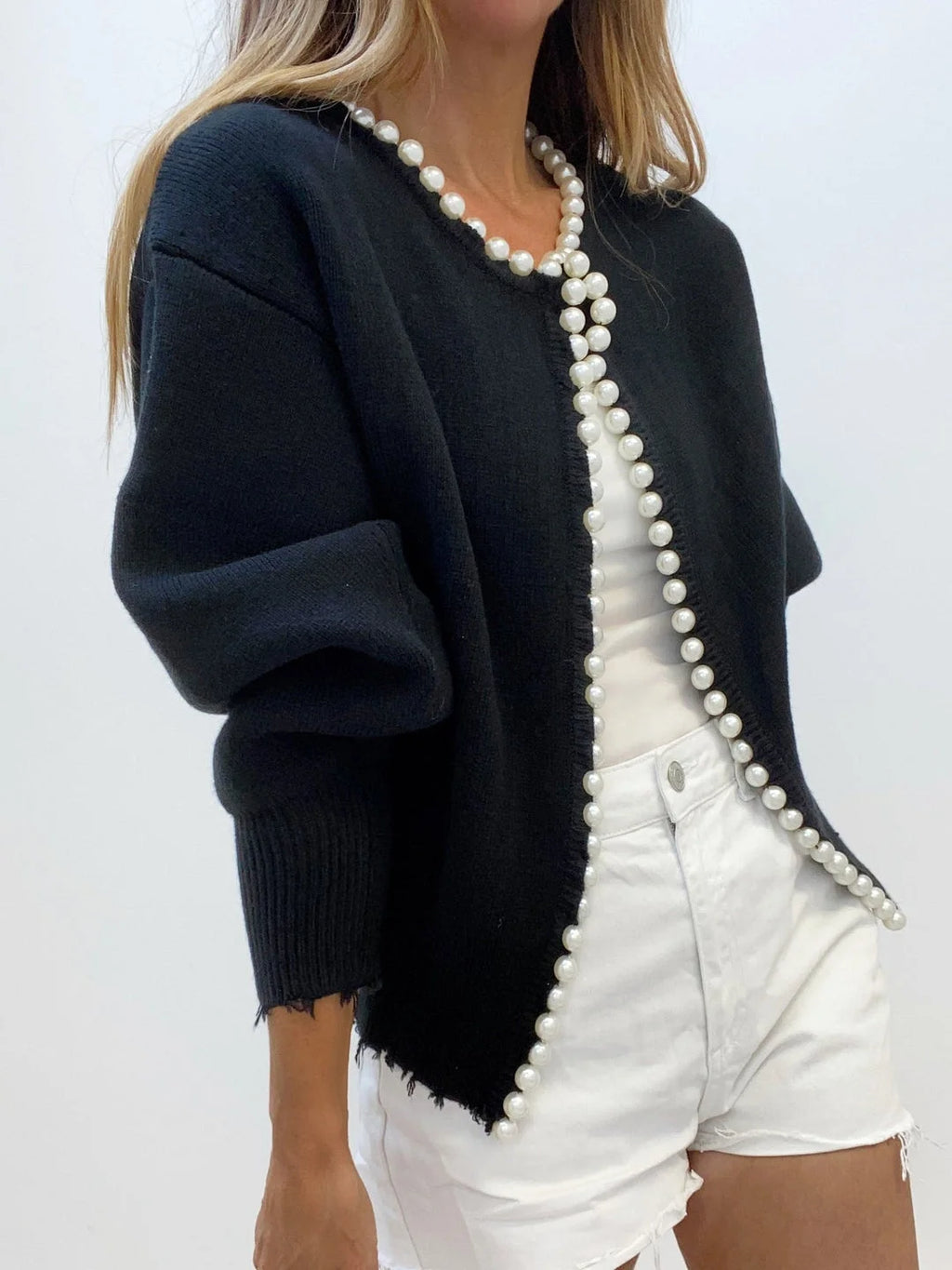 Women's open front cardigan featuring pearl trim, crafted from soft knit fabric for comfortable layering in any outfit.