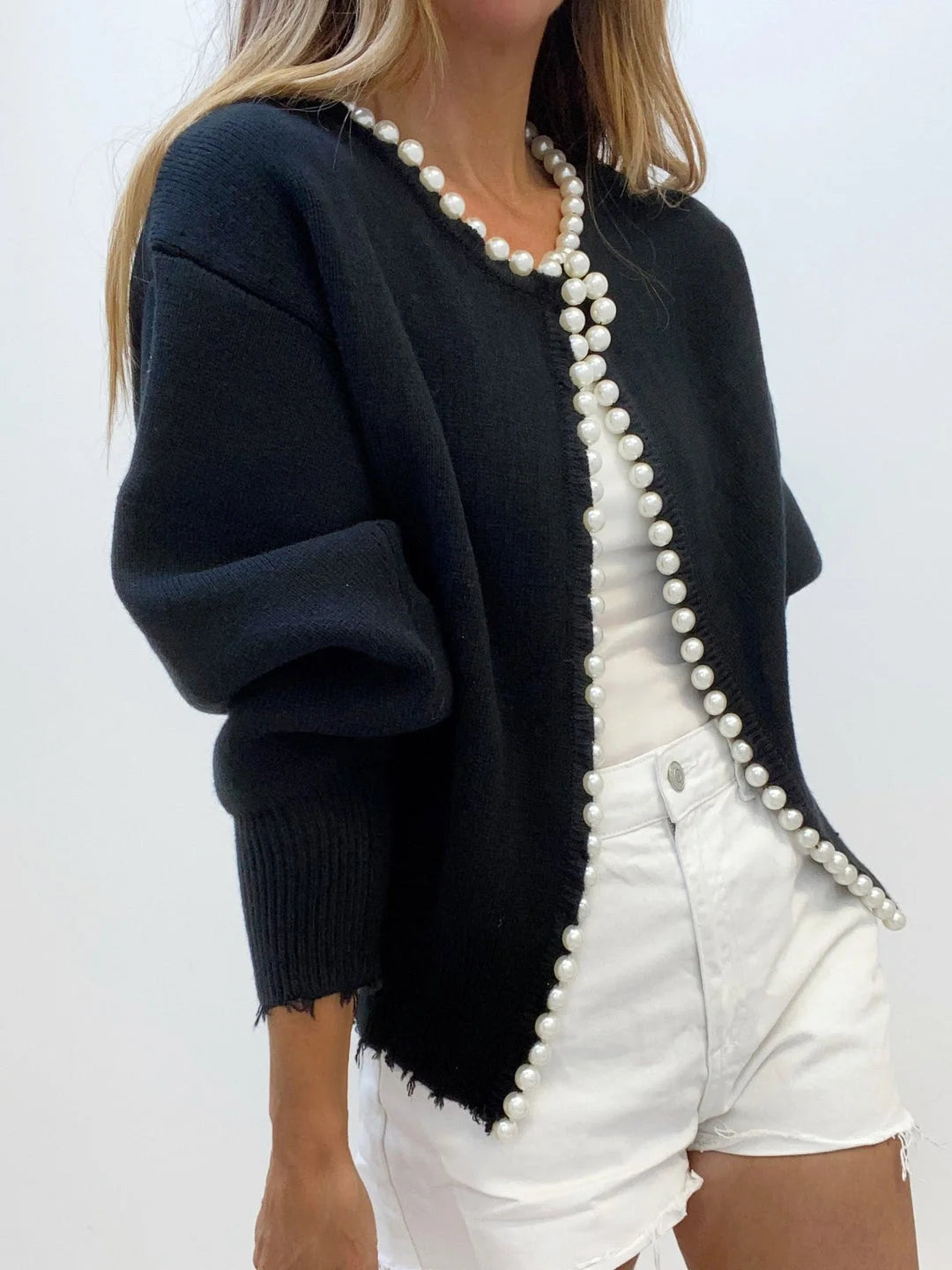 Women's open front cardigan featuring pearl trim, crafted from soft knit fabric for comfortable layering in any outfit.