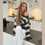 Women's casual striped sweater made from soft cotton blend, featuring a relaxed fit and comfortable knit for everyday wear.