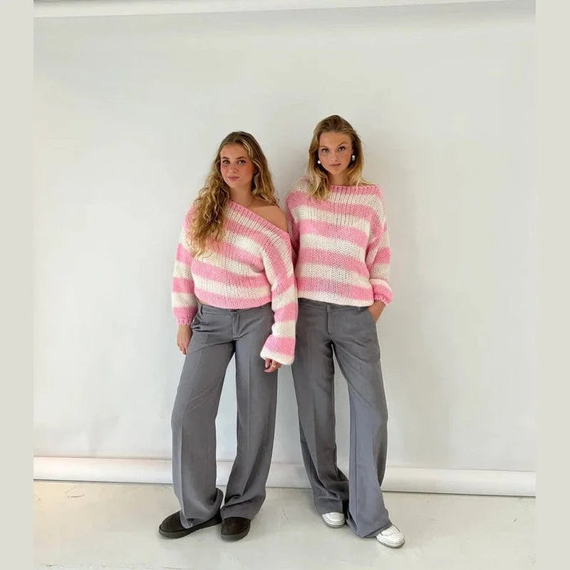 Cozy women's striped sweater made from soft knit fabric, featuring a relaxed fit and crew neckline for everyday comfort.