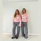 Cozy women's striped sweater made from soft knit fabric, featuring a relaxed fit and crew neckline for everyday comfort.