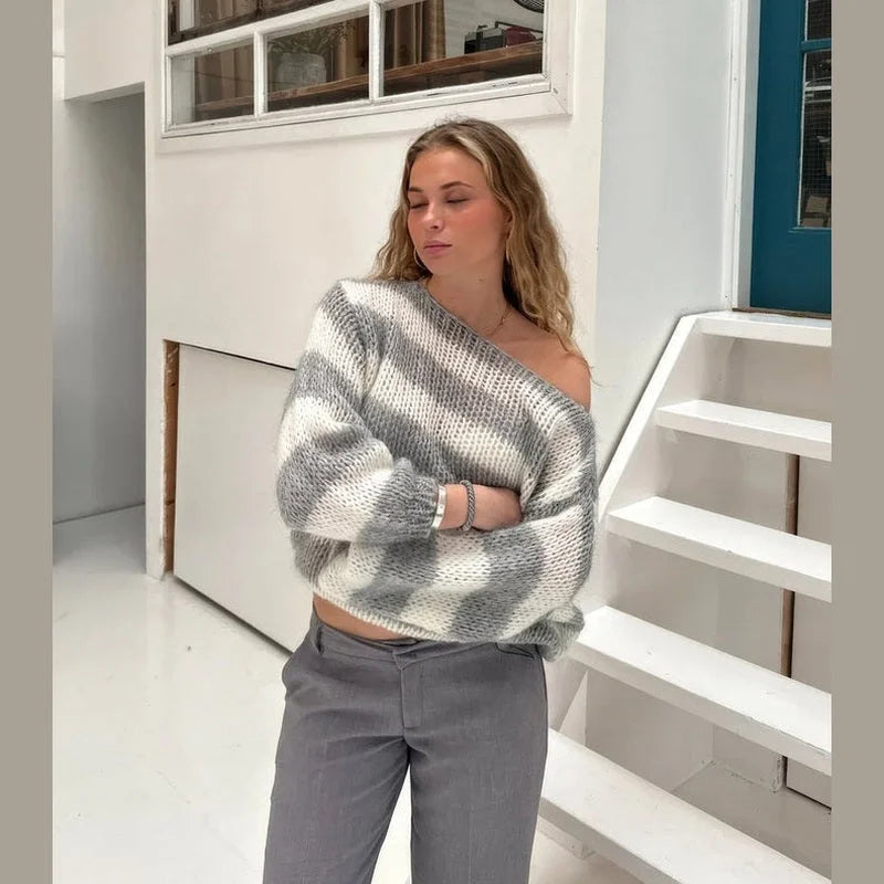 Women's casual striped sweater made from soft cotton blend, featuring a cozy fit and relaxed neckline for everyday comfort.