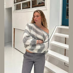 Women's casual striped sweater made from soft cotton blend, featuring a cozy fit and relaxed neckline for everyday comfort.