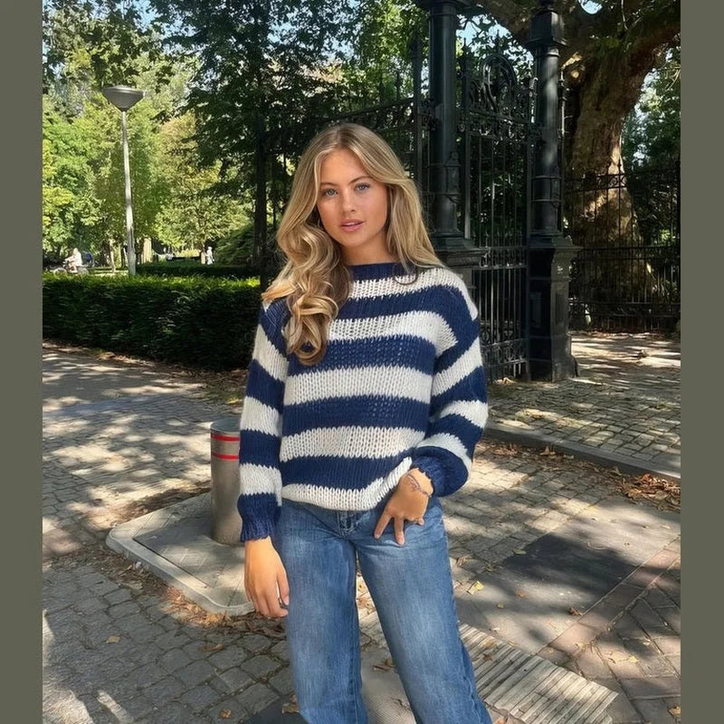 Women's casual striped sweater made from soft cotton blend, featuring a relaxed fit and ribbed cuffs for everyday comfort.