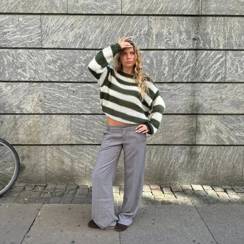 Women's casual striped sweater made of soft cotton blend, featuring a relaxed fit and ribbed cuffs for everyday comfort.