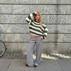 Women's casual striped sweater made of soft cotton blend, featuring a relaxed fit and ribbed cuffs for everyday comfort.