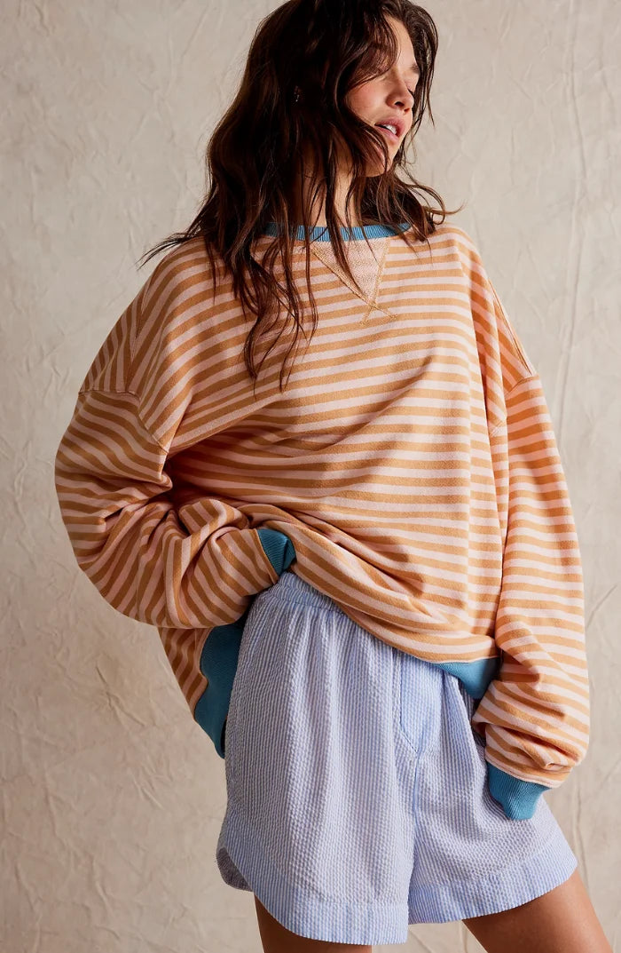 Women's casual striped sweater in soft cotton, featuring a relaxed fit and comfortable long sleeves for everyday wear.