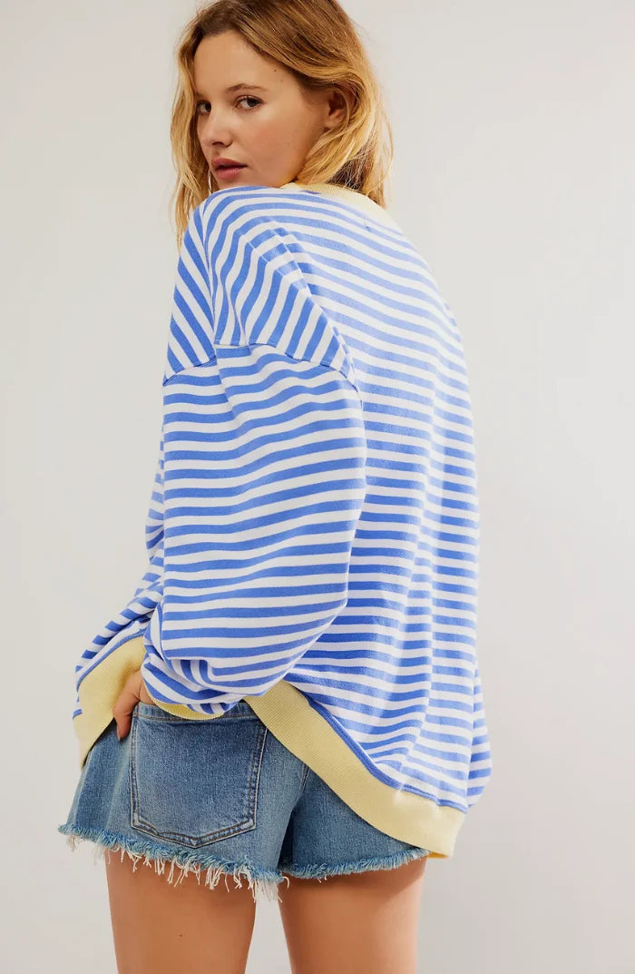 Relaxed fit women's striped sweater made from soft cotton blend, featuring long sleeves and a classic crew neckline.