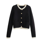 Women's chic knitted button-up cardigan made from soft, breathable yarn with a classic ribbed texture and stylish buttons.