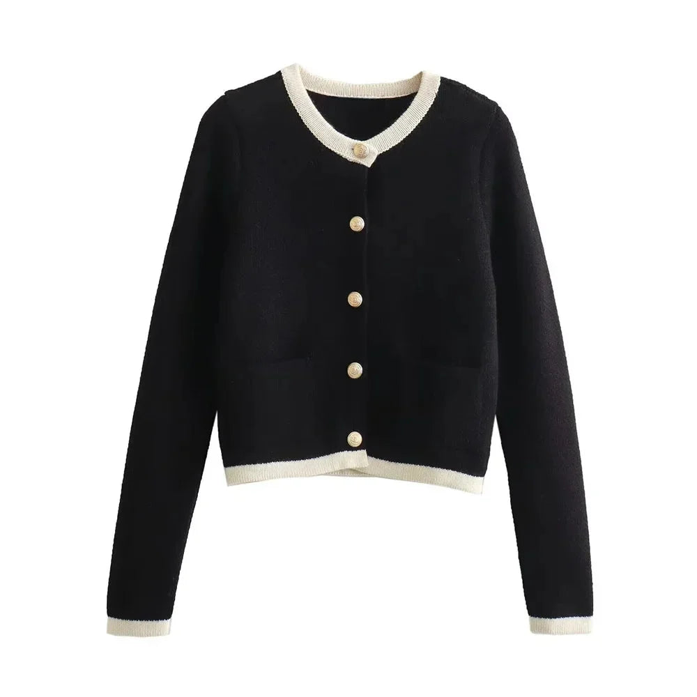 Women's chic knitted button-up cardigan made from soft, breathable yarn with a classic ribbed texture and stylish buttons.