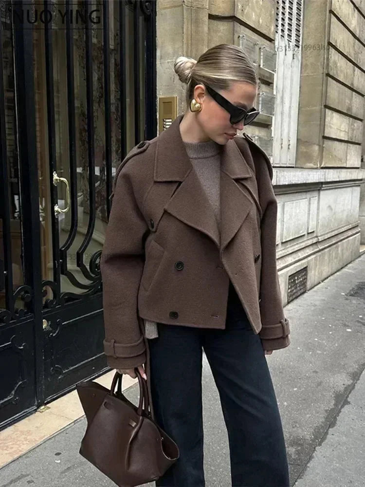 Women's chocolate cropped double-breasted jacket featuring a classic lapel design and made from soft, durable fabric.