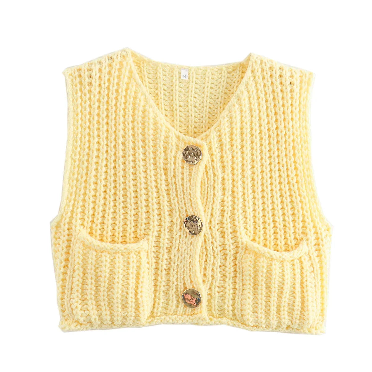 Women's chunky knit vest with pockets, crafted from soft acrylic yarn, featuring a relaxed fit and textured pattern.