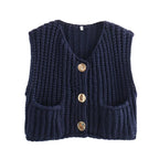 Women's chunky knit vest with pockets, made of soft acrylic yarn, featuring a relaxed fit and ribbed edges for a cozy look.