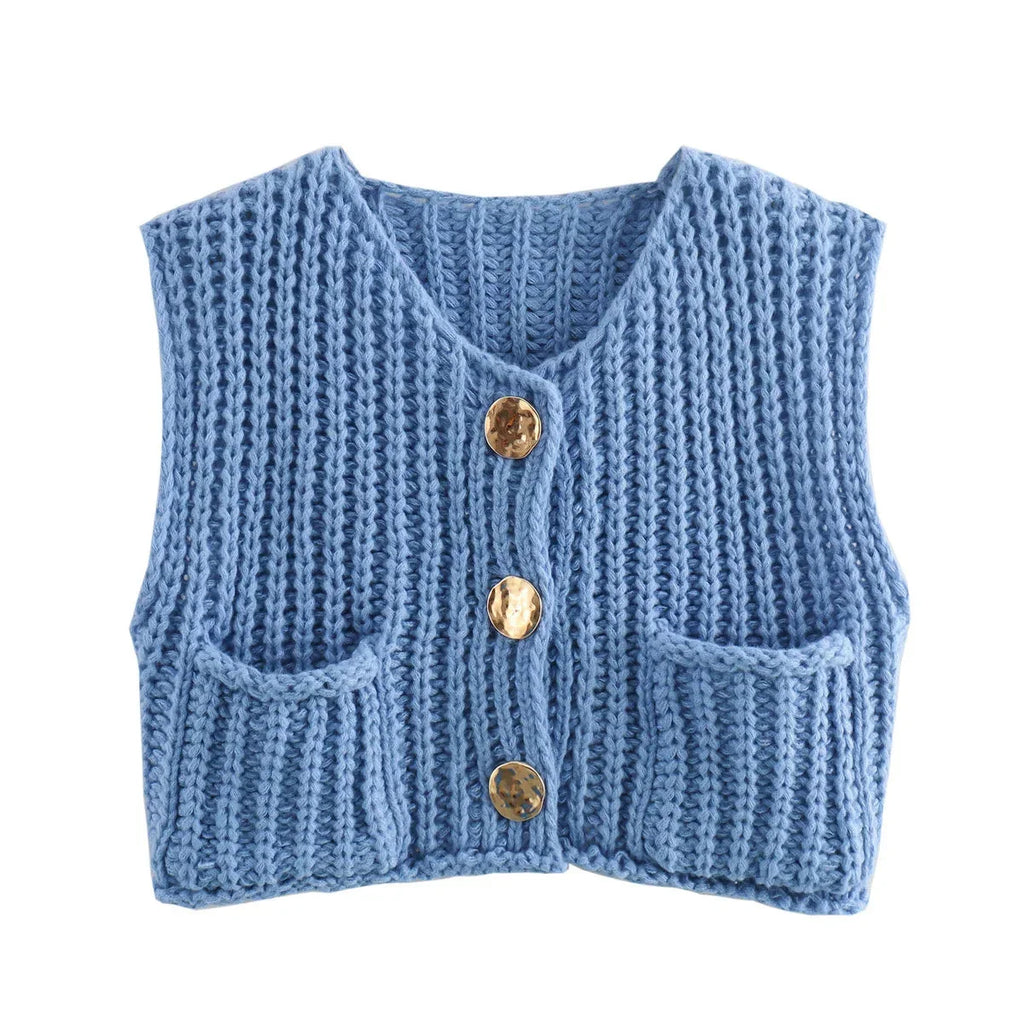 Women's chunky knit vest with pockets, featuring a cozy textured design and comfortable fit for layering in cool weather.