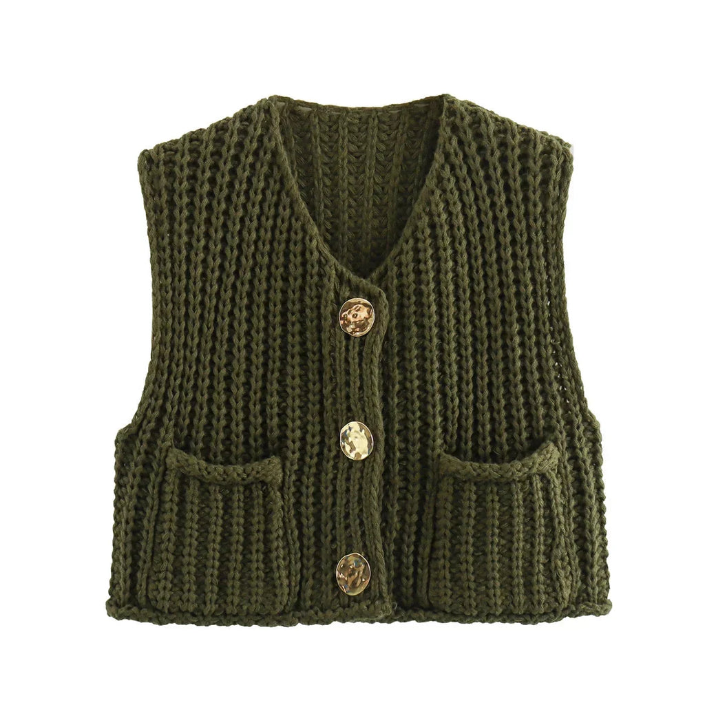 Women's chunky knit vest with pockets in soft yarn, featuring a relaxed fit and textured design for comfortable layering.