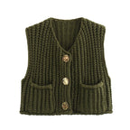 Women's chunky knit vest with pockets in soft yarn, featuring a relaxed fit and textured design for comfortable layering.