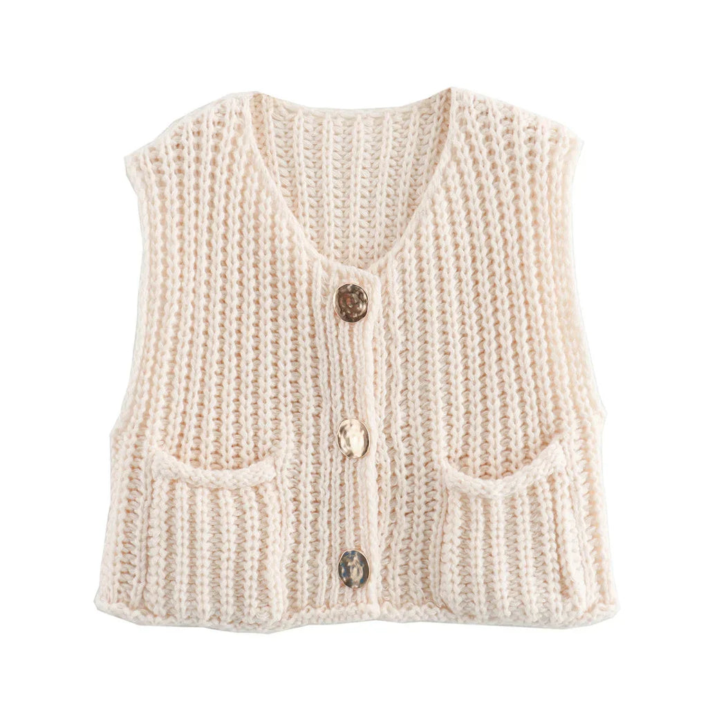 Women's chunky knit vest featuring spacious pockets, made from soft yarn for warmth and comfort in a cozy, relaxed fit.