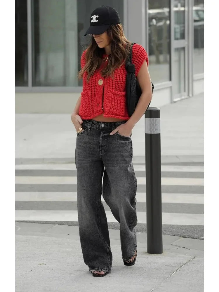 Women's chunky knit vest featuring a cozy texture, practical side pockets, and a relaxed fit for casual layering.