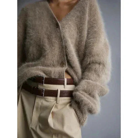 Women's cozy button-up cardigan with long sleeves, made from soft knit fabric with a classic design and functional buttons.