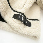 Women's cream zip-up teddy jacket made from soft fabric, featuring pockets and a relaxed fit for comfort and warmth.