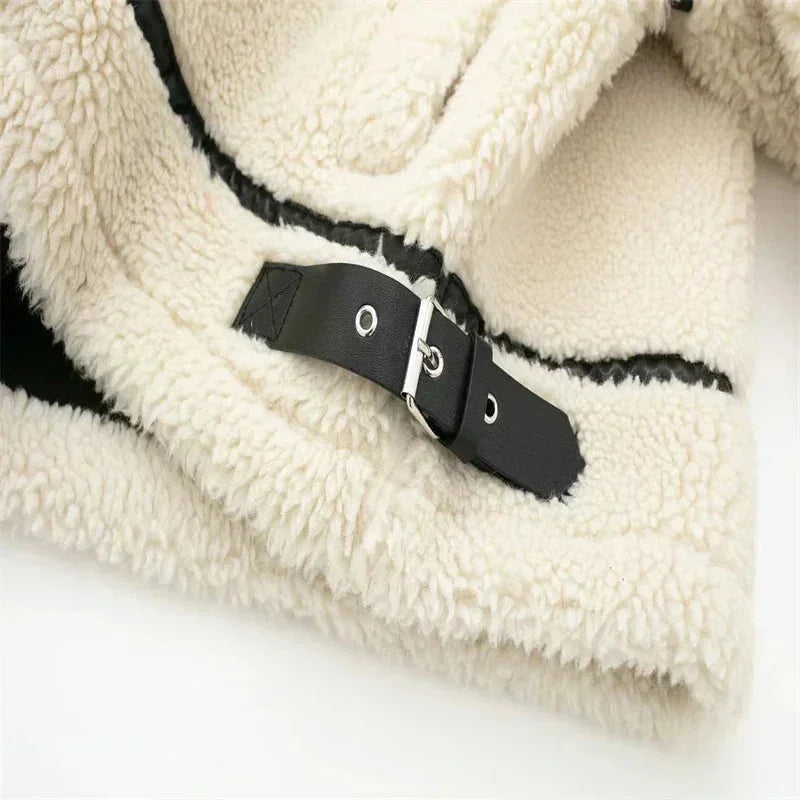 Women's cream zip-up teddy jacket made from soft fabric, featuring pockets and a relaxed fit for comfort and warmth.
