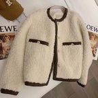 Women's fleece jacket featuring a stylish trim, soft fabric, and comfortable fit for everyday wear.