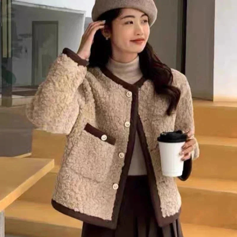 Women’s fleece jacket featuring a soft texture, stylish trim, and a comfortable fit for casual outings and everyday wear.