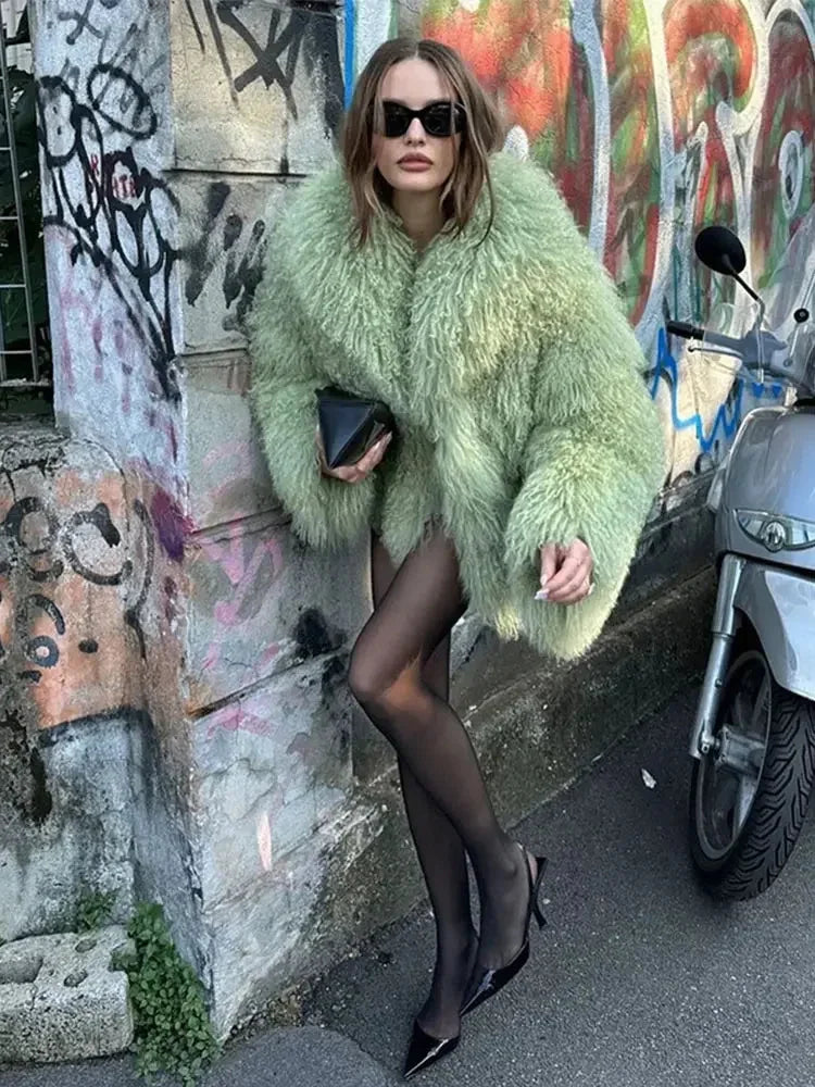 Women's cozy fluffy faux fur jacket in soft synthetic material with a relaxed fit and open front design. Perfect for…