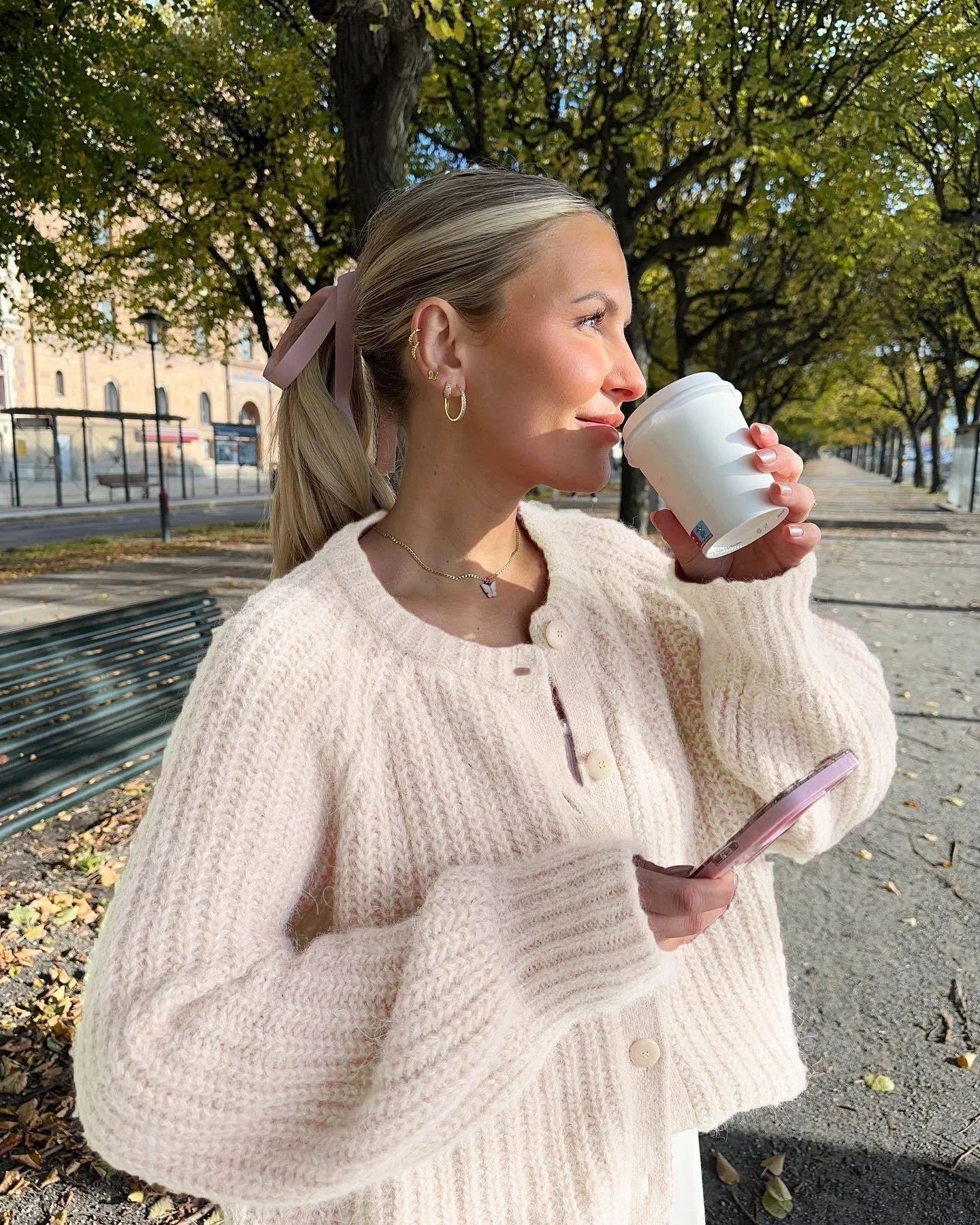 Women's cozy knit cardigan featuring a button front, soft fabric, and a relaxed fit for comfortable layering.