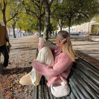 Women's cozy knit cardigan featuring a button front, crafted from soft material for warmth and comfort, perfect for layering.