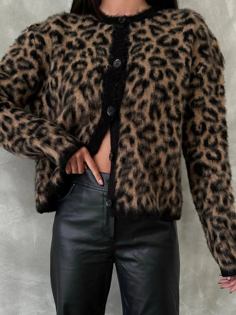 Women's knitted cardigan in soft fabric, featuring a button front and a relaxed fit, perfect for layering in cooler weather.