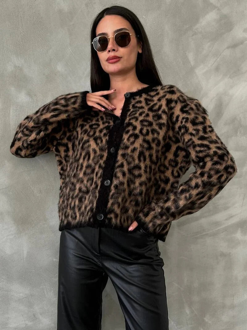 Women's cozy knitted cardigan featuring a button front, made from soft yarn, with a relaxed fit and ribbed cuffs.