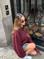 Women’s oversized sweater with round neck, made from soft cotton blend, featuring a relaxed fit and ribbed hem detail.