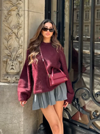 Warm women's oversized sweater with a round neck, made from soft knit fabric for comfort and relaxed fit.