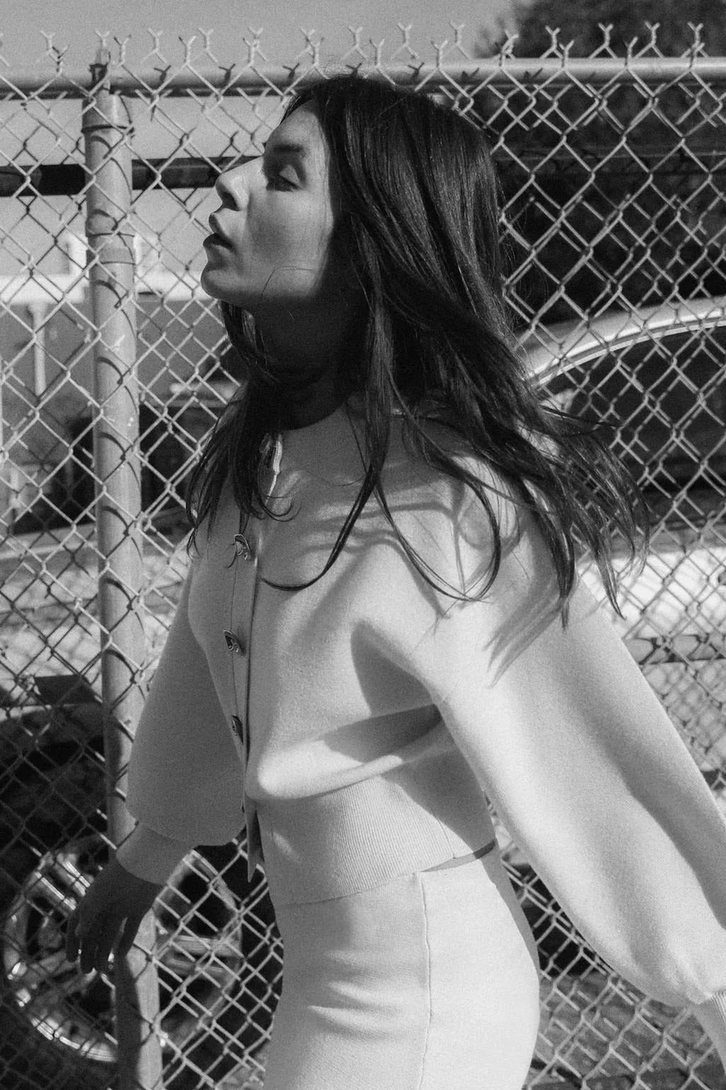 Women's cream cardigan made of soft knit fabric featuring large statement buttons and a relaxed fit for casual wear.