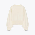 Women's cream cardigan with large statement buttons, crafted from soft knit material with a relaxed fit for everyday comfort.