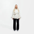 Women's cream jacket featuring a tie belt and fur cuffs, crafted from soft fabric for a stylish, cozy look.